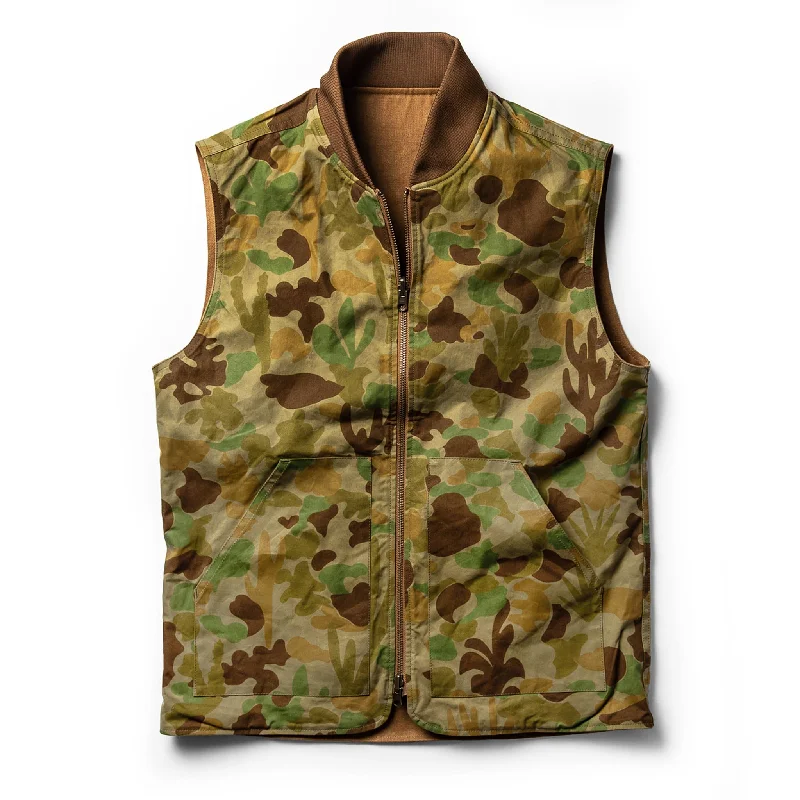 Quilted men waistcoats filled with down for winter warmth The Taylor Stitch x Gear Patrol Reversible Able Vest in Arid Camo