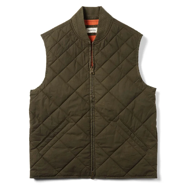 Linen men vest in earthy tones for a summer beach vibe The Quilted Bomber Vest in Olive Dry Wax